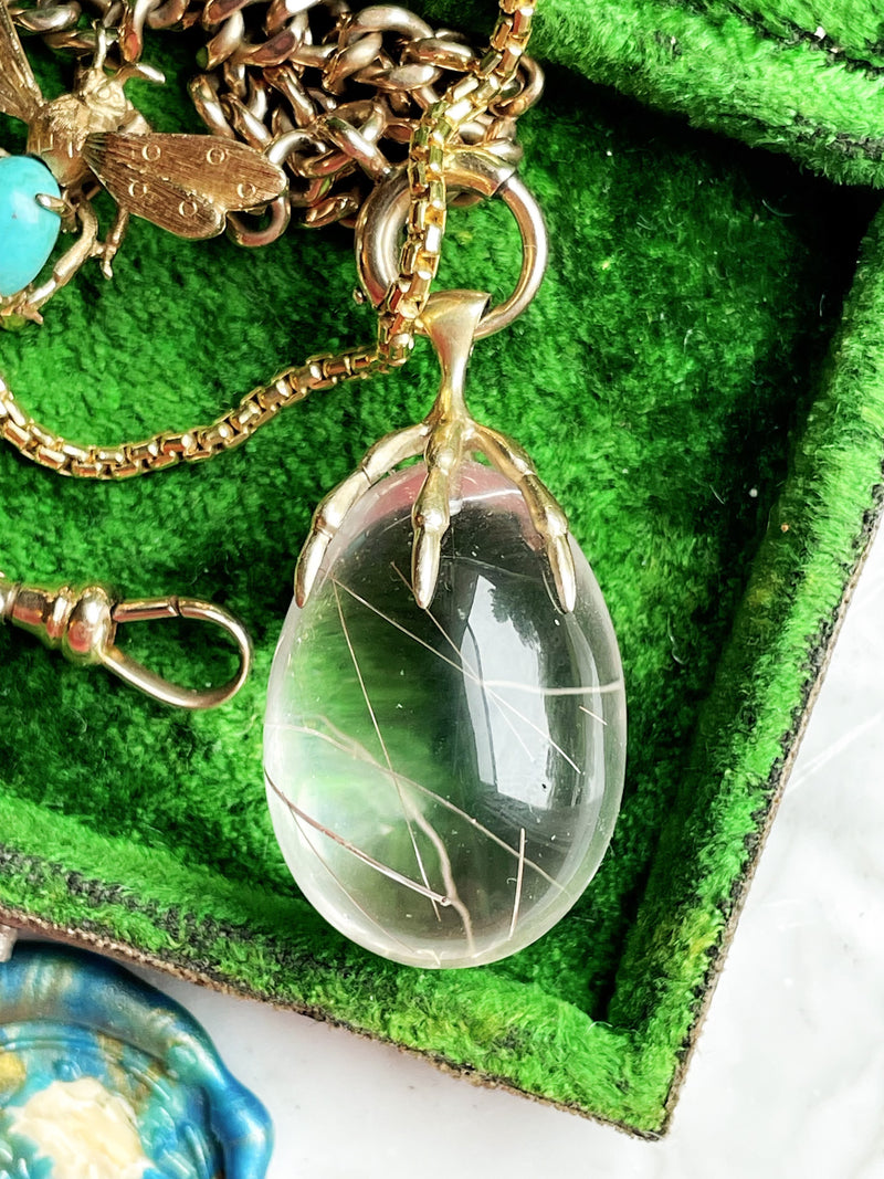 10k Rutile Quartz Egg w/ Avian Claw