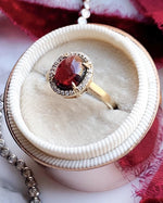 14k Garnet Cabochon with Diamond Halo Ring