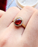 14k Garnet Cabochon with Diamond Halo Ring