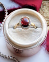 14k Garnet Cabochon with Diamond Halo Ring